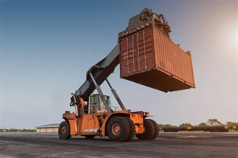 can a skid steer lift a 20ft container|Moving shipping containers .